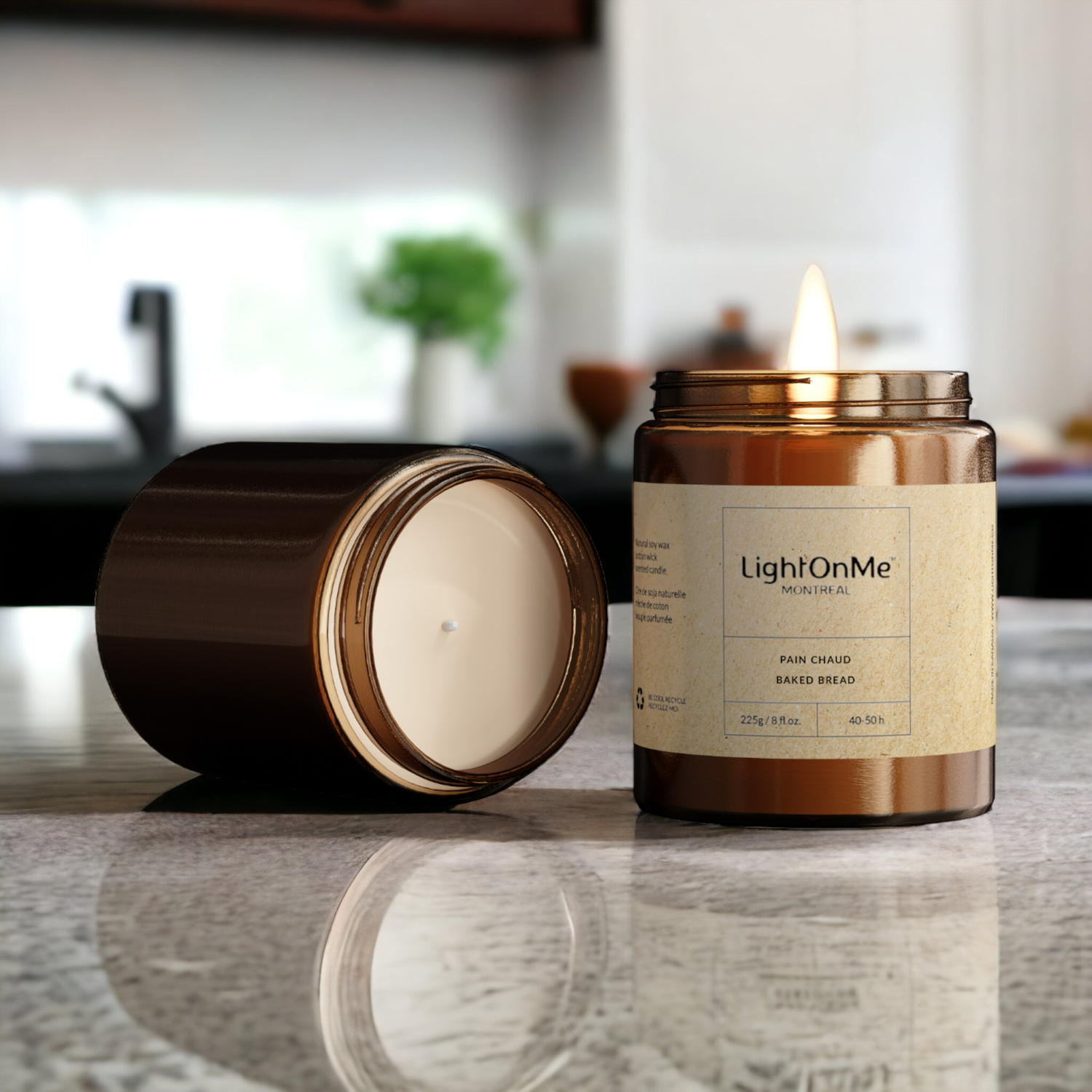 a candle sitting on top of a table next to a canister