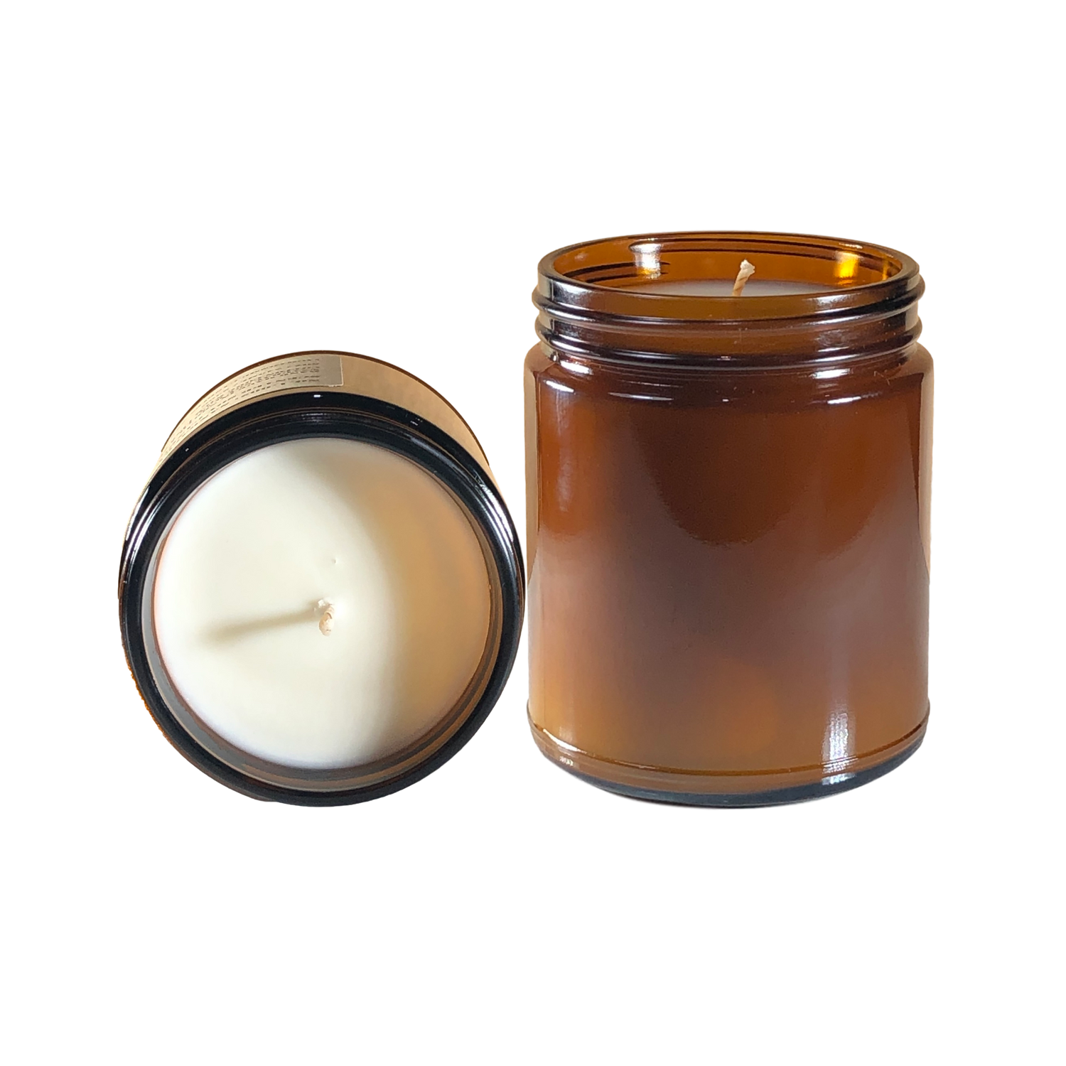 a glass jar with a candle inside of it